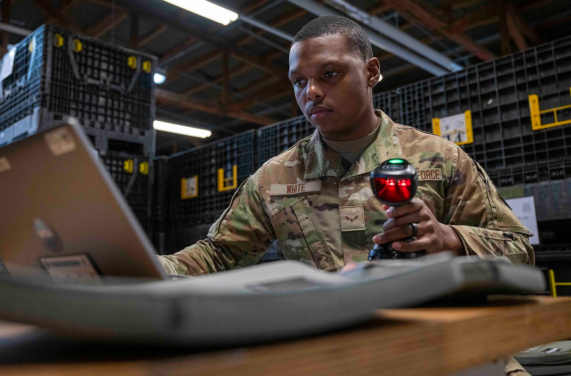 U.S. Air Force Airman 1st Class Deshawn White, 52nd Logistics Readiness Squadron material management, scans individual plates into a Radio Frequency Identification (RFID) system at Spangdahlem Air Base, Germany, Feb. 7, 2025. By installing RFID technology, LRS will eliminate 7,000 man-hours annually